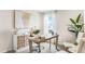 Bright and inviting home office featuring a spacious desk, stylish storage, and abundant natural light at 3206 Partington Blvd, Davenport, FL 33837
