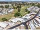 Community aerial view showcases the golf course and well-maintained homes with lush landscaping at 367 Par Pines Blvd, Davenport, FL 33837