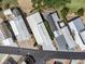 Aerial view of homes with carports, mature landscaping, and well-maintained lawns at 367 Par Pines Blvd, Davenport, FL 33837