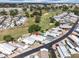 Bird's-eye view of a vibrant community near a manicured golf course, offering a picturesque living environment at 367 Par Pines Blvd, Davenport, FL 33837