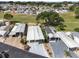 Aerial view of homes with carports, mature landscaping, and well-maintained lawns at 367 Par Pines Blvd, Davenport, FL 33837
