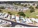 Aerial view of homes with carports, mature landscaping, and well-maintained lawns at 367 Par Pines Blvd, Davenport, FL 33837