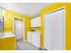 Bright bathroom and laundry area with washer, dryer, storage, and sink, all with a matching aesthetic at 367 Par Pines Blvd, Davenport, FL 33837