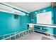 Functional garage space with workbench, shelving, and pegboard, ideal for hobbies and storage at 367 Par Pines Blvd, Davenport, FL 33837