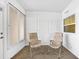 Enclosed lanai with comfortable seating, neutral decor, and bright natural light at 367 Par Pines Blvd, Davenport, FL 33837