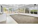 Inviting sunroom with large windows overlooking lush green landscaping at 367 Par Pines Blvd, Davenport, FL 33837