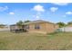 Spacious backyard with a patio, lawn, and a privacy fence at 4544 Point Look Out Rd, Orlando, FL 32808
