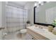Clean bathroom with a shower and a simple vanity at 4544 Point Look Out Rd, Orlando, FL 32808