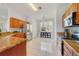 Well-lit kitchen with granite countertops, stainless steel appliances, and tiled flooring at 4544 Point Look Out Rd, Orlando, FL 32808