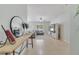 Bright living room featuring tile floors, a ceiling fan, and large windows for lots of natural light at 4544 Point Look Out Rd, Orlando, FL 32808