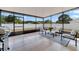 Bright sunroom with comfortable seating and a view of the backyard at 4544 Point Look Out Rd, Orlando, FL 32808