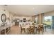 Open concept dining and kitchen area with lots of natural light and a seamless flow at 4718 Yellow Elder Way, Kissimmee, FL 34758