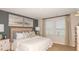 Comfortable main bedroom with neutral tones, two windows and tasteful decor at 4718 Yellow Elder Way, Kissimmee, FL 34758