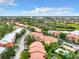 Aerial view of the community featuring buildings, parking, a pool, and lush surroundings at 5160 Conroy Rd # 1423, Orlando, FL 32811