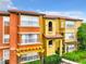 Exterior view of the apartment buildings showing architectural details and landscaping at 5160 Conroy Rd # 1423, Orlando, FL 32811
