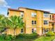 Exterior view of the apartment buildings showing the landscaping and architectural details at 5160 Conroy Rd # 1423, Orlando, FL 32811