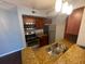 Kitchen area featuring stainless steel appliances, wooden cabinetry, and stone countertops at 5160 Conroy Rd # 1423, Orlando, FL 32811