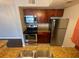 Kitchen with stainless appliances, granite countertops, and dark wood cabinets at 5160 Conroy Rd # 1423, Orlando, FL 32811