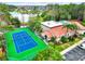 Aerial shot featuring a vibrant tennis court and nearby clubhouse in a desirable community setting at 5160 Conroy Rd # 1423, Orlando, FL 32811