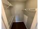 Walk-in closet featuring wire shelving and hard surface floors at 5160 Conroy Rd # 1423, Orlando, FL 32811