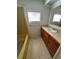 Bathroom with wooden cabinets, white sink, and tile flooring at 551 Pine Needle Ct, Lake Mary, FL 32746
