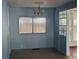 Dining room with large window and vintage chandelier at 551 Pine Needle Ct, Lake Mary, FL 32746