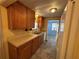 A kitchen featuring wood cabinets, double basin sink, and appliances on tile flooring at 551 Pine Needle Ct, Lake Mary, FL 32746