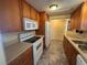 Kitchen with appliances, plenty of counter space, and wood cabinets at 551 Pine Needle Ct, Lake Mary, FL 32746