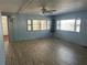 Living room with large windows providing natural light and a ceiling fan at 551 Pine Needle Ct, Lake Mary, FL 32746