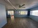 Living room with lots of light, a ceiling fan, and vinyl flooring at 551 Pine Needle Ct, Lake Mary, FL 32746