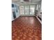 Enclosed sunroom with many windows and a door to the outside at 551 Pine Needle Ct, Lake Mary, FL 32746