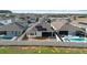 Aerial view shows neighborhood homes, pools, and fenced yards at 5511 Orange Orchard Dr, Winter Garden, FL 34787