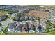 Wide angle shot of neighborhood homes, cul-de-sac, and green grass at 5511 Orange Orchard Dr, Winter Garden, FL 34787