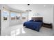 Spacious primary bedroom featuring tile floors, large windows, and a comfortable queen bed at 5511 Orange Orchard Dr, Winter Garden, FL 34787