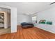 Bedroom with wood-look floors, a two-toned paint scheme, and a bed at 55119 5Th St, Astor, FL 32102