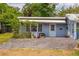 View of cozy exterior with gravel and small greenery around the house at 55119 5Th St, Astor, FL 32102