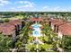 Beautiful aerial view of resort-style apartments and pools with lush landscaping and meticulous grounds at 5530 Metrowest Blvd # 309, Orlando, FL 32811