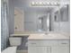 Bathroom featuring a shower/tub combo, vanity with sink and a large mirror at 5530 Metrowest Blvd # 309, Orlando, FL 32811