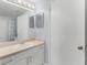 Bathroom featuring a shower/tub combo, vanity with sink and a large mirror at 5530 Metrowest Blvd # 309, Orlando, FL 32811