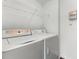 Practical laundry area with a washing machine and dryer at 5530 Metrowest Blvd # 309, Orlando, FL 32811