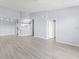 Spacious living room features sleek flooring, recessed lighting, and an open layout leading to the kitchen at 5530 Metrowest Blvd # 309, Orlando, FL 32811