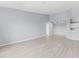 Bright living room featuring neutral walls, modern flooring, recessed lighting, and an open layout to the kitchen at 5530 Metrowest Blvd # 309, Orlando, FL 32811