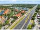 An aerial view of the community in proximity to the road and nearby community buildings at 5566 Metrowest Blvd # 304, Orlando, FL 32811