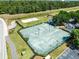 Aerial view of community tennis and sand volleyball courts at 5566 Metrowest Blvd # 304, Orlando, FL 32811