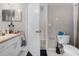 Bathroom featuring a vanity with sink, toilet and open doorway at 5566 Metrowest Blvd # 304, Orlando, FL 32811