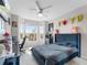 Inviting bedroom with a large window and a comfortable bed at 5566 Metrowest Blvd # 304, Orlando, FL 32811