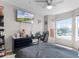 Bedroom featuring a TV, large windows, and comfortable bedding at 5566 Metrowest Blvd # 304, Orlando, FL 32811