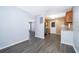 A well-lit kitchen with gray wood laminate flooring, wooden cabinets at 5601 Andora St, Orlando, FL 32807