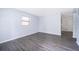 A bright living room with modern gray wood laminate flooring at 5601 Andora St, Orlando, FL 32807