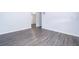 Spacious living room with modern gray wood laminate flooring at 5601 Andora St, Orlando, FL 32807
